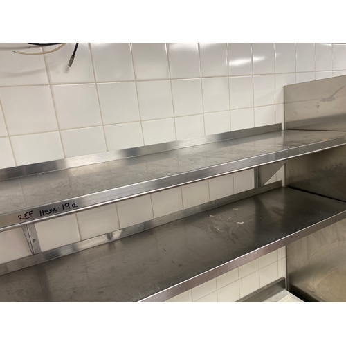 20 - Two stainless steel shelves. One shelf has a wire hanging rail on the front. 
 1500mm L 400mm D 
 Br... 