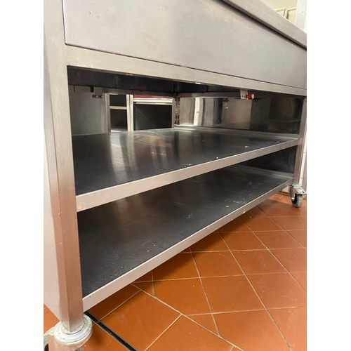 22 - Two stainless-steel, free-standing work units. Two lower shelves with two end draws. On four caster ... 