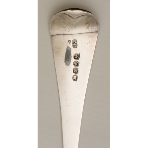 127 - A late Georgian silver basting spoon, London 1808, with engraved crane crest and motto 'Dum Spiro Sp... 