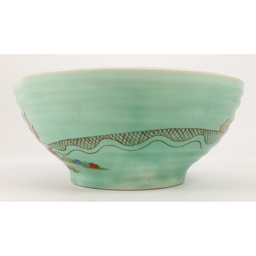 13 - A Clarice Cliff 'Chalet' (no. 633) ribbed bowl - painted with an orange roofed house in a garden lan... 