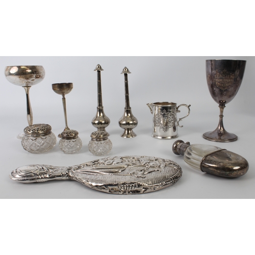 143 - A small group of silver items comprising a Continental 800 silver and cut-glass spirit flask, three ... 