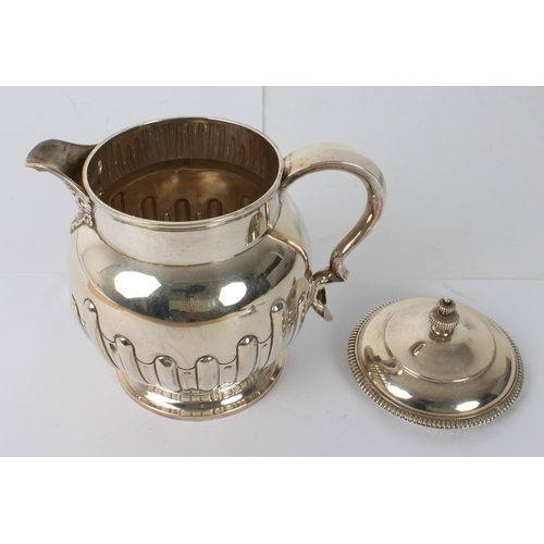 159 - An Edwardian silver jug - Cooper Brothers & Sons Ltd., Sheffield 1905, of globular form with half-fl... 