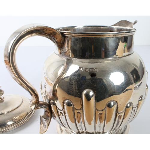 159 - An Edwardian silver jug - Cooper Brothers & Sons Ltd., Sheffield 1905, of globular form with half-fl... 