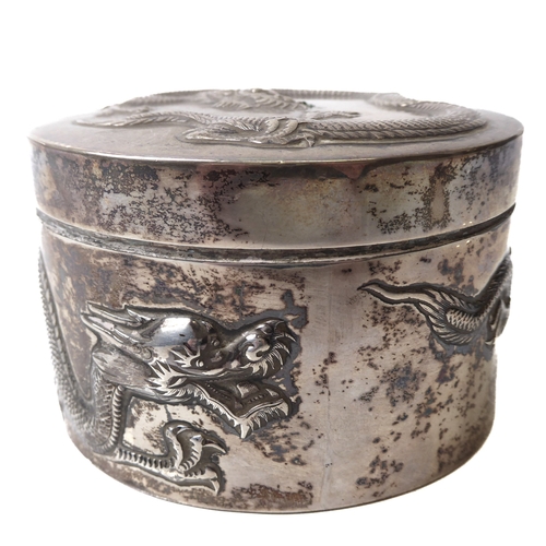 168 - Three Chinese silver circular boxes - by Wang Hing & Co., all repoussé decorated with long bodied dr... 