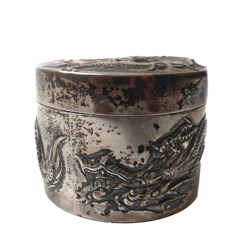 168 - Three Chinese silver circular boxes - by Wang Hing & Co., all repoussé decorated with long bodied dr... 