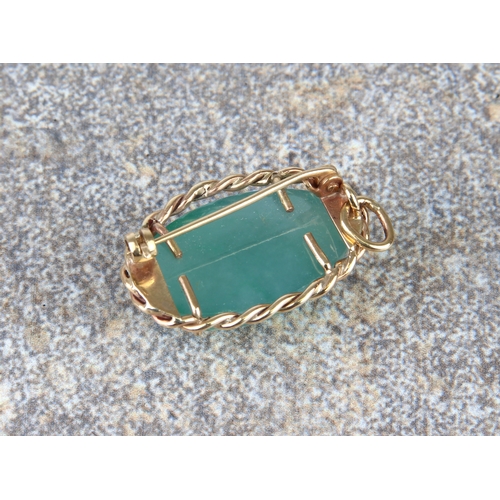 187 - A 9ct gold and aventurine pendant brooch - the oval, cabochon aventurine within a rope twist border,... 