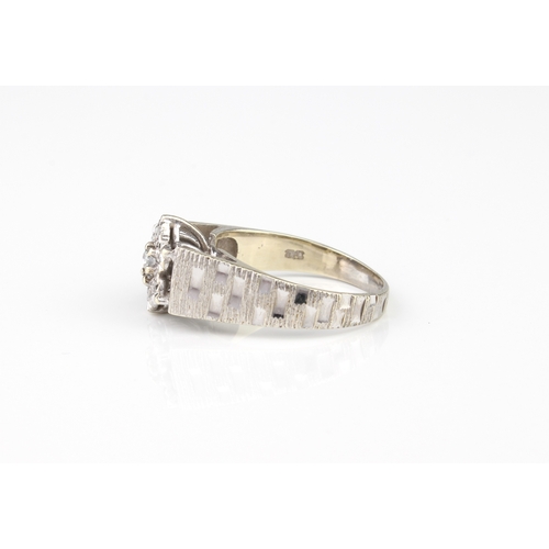 211 - A vintage 9ct white gold and diamond cluster ring - hallmarked Sheffield 1978, the central brilliant... 