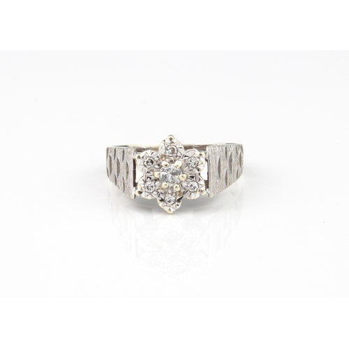 211 - A vintage 9ct white gold and diamond cluster ring - hallmarked Sheffield 1978, the central brilliant... 