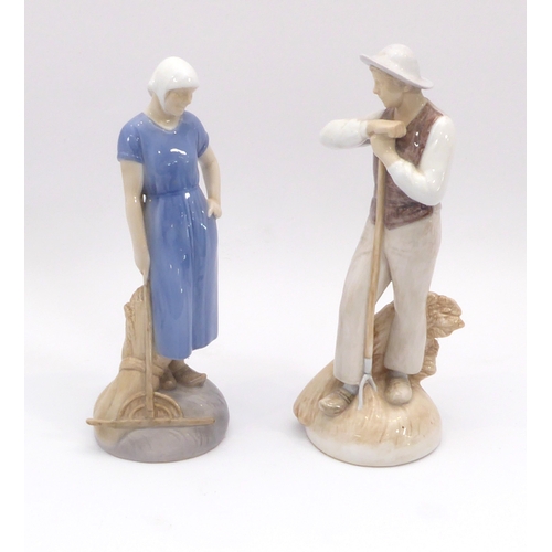 25 - A pair of Bing & Grondhal porcelain figures of farmers by Axel Locher - no. 2049 and 2050, both sign... 