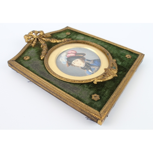 277 - A French watercolour portrait miniature of a naval officer in a gilt and green velvet frame, early 2... 