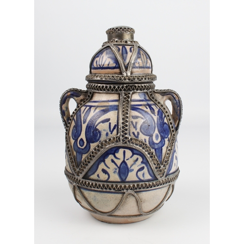 32 - A white-metal band Iznik or Persian covered vase