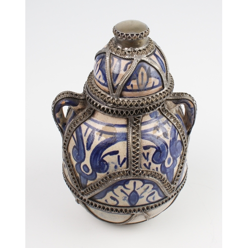 32 - A white-metal band Iznik or Persian covered vase