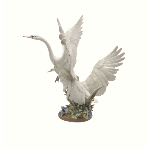 40 - A large and impressive Lladro group titled 'Swans Take Flight' - c.1992, sculpted by Salvador Debón,... 