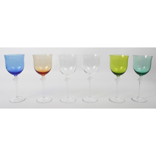 44 - A set of six Lalique Roxane coloured wine glasses - comprising four differently coloured and two cle... 