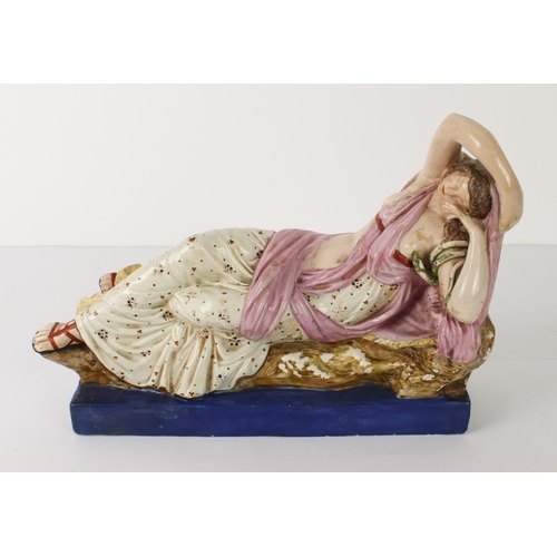 5 - An early 19th century pearlware figure of Cleopatra by Enoch Wood - the reclining figure dressed in ... 