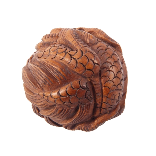 59 - A carved boxwood netsuke