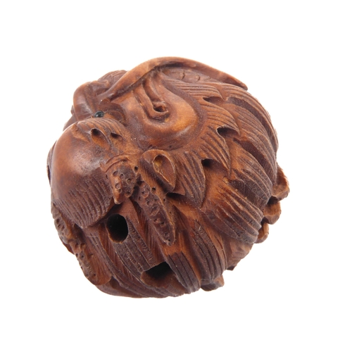 59 - A carved boxwood netsuke