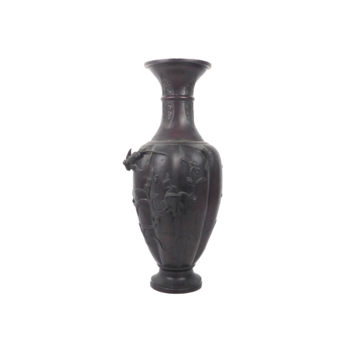 61 - A large Japanese patinated bronze vase - Meiji period (1868-1912), of eight lobed baluster form with... 