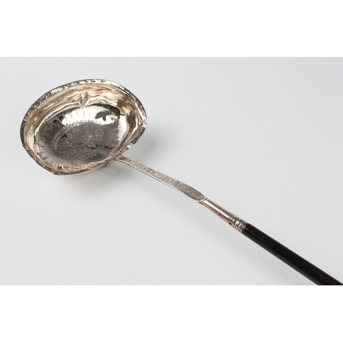 90 - A George IV silver toddy or punch ladle - London 1825, maker's mark rubbed, with chased foliate rose... 