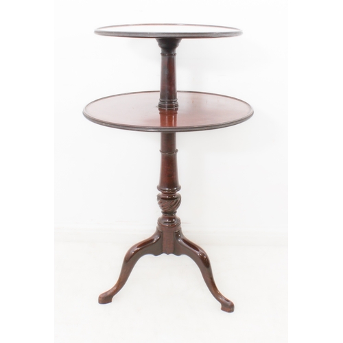 411 - A George III mahogany two-tier dumb waiter - of good colour, the two graduated, dished tiers revolvi... 