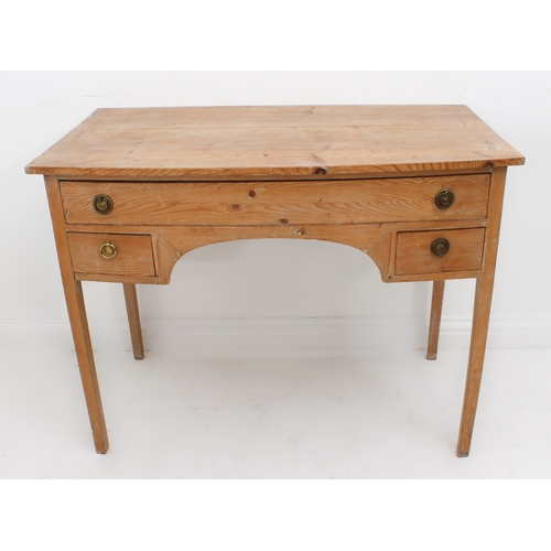 415 - An early 19th century pine bowfront kneehole dressing table - with one long and two short drawers wi... 