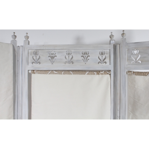 431 - An off-white painted wooden three-fold screen - with tulip pierced panels and turned finials over re... 