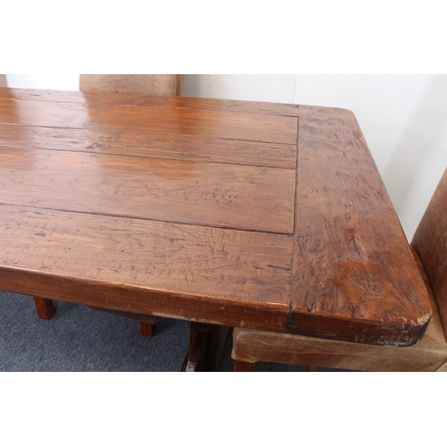 456 - A fine teak refectory-style dining table - the richly coloured, cleated, five-plank top on trestle e... 