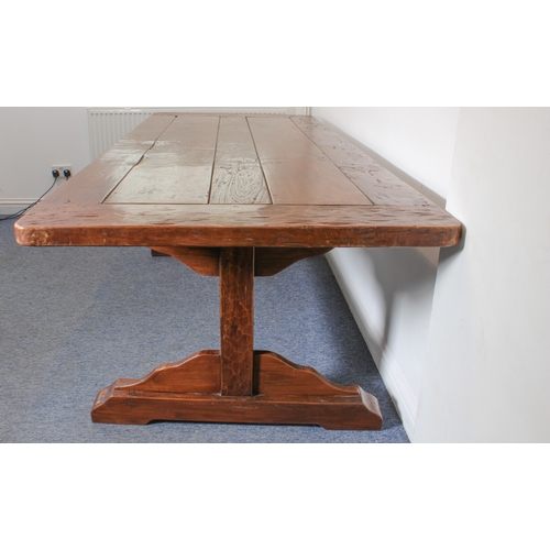 456 - A fine teak refectory-style dining table - the richly coloured, cleated, five-plank top on trestle e... 