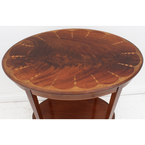 457 - An Edwardian mahogany and marquetry oval two-tier occasional table - the flame mahogany top with a s... 