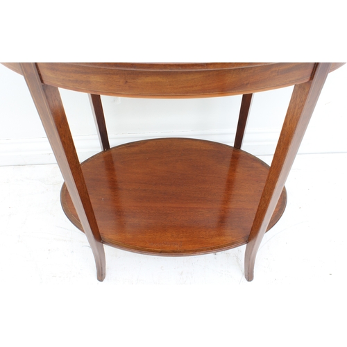 457 - An Edwardian mahogany and marquetry oval two-tier occasional table - the flame mahogany top with a s... 