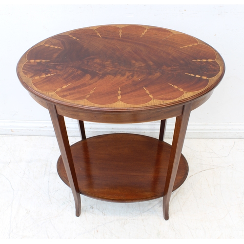 457 - An Edwardian mahogany and marquetry oval two-tier occasional table - the flame mahogany top with a s... 