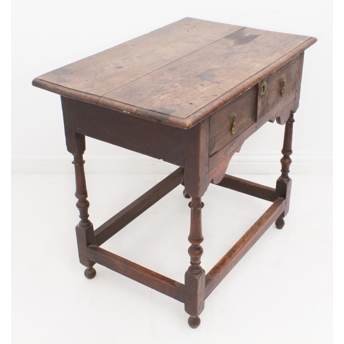 468 - An early 18th century joined oak single-drawer side table - the boarded, moulded top over a single d... 