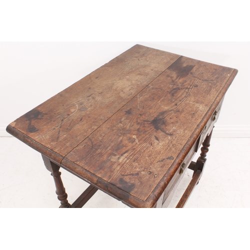 468 - An early 18th century joined oak single-drawer side table - the boarded, moulded top over a single d... 