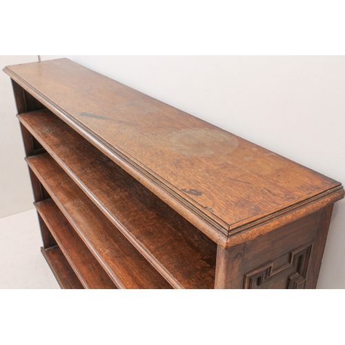 469 - A 19th century oak open bookcase - the moulded top over four graduated open shelves, the sides with ... 