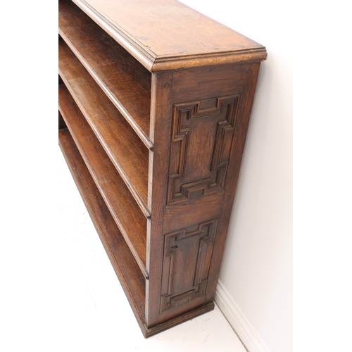 469 - A 19th century oak open bookcase - the moulded top over four graduated open shelves, the sides with ... 