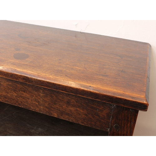 470 - A 19th century panelled oak cabinet on stand - the chamfered top over a pair of geometric mitre pane... 