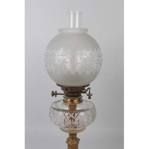 541 - An Edwardian brass and cut glass oil lamp by Hinks & Sons for Maple of London, the rounded square ba... 