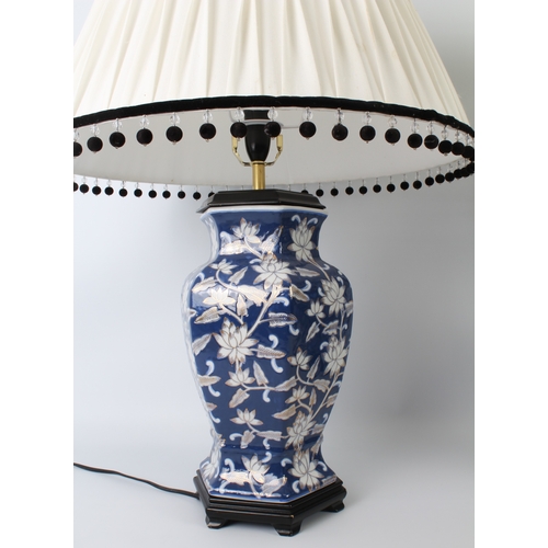 544 - A pair of Oriental blue and white porcelain vase lamps - of hexagonal baluster form, decorated with ... 