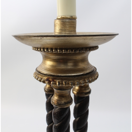 548 - A bronzed and parcel-gilt triple-column lamp in the Regency style - modern, the dished top on three ... 