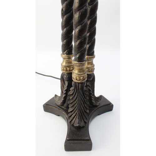 548 - A bronzed and parcel-gilt triple-column lamp in the Regency style - modern, the dished top on three ... 