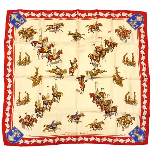 572 - A boxed silk scarf by L.R. of Paris - titled 'Le Carrousel de Saumur', depicting equine military sub... 