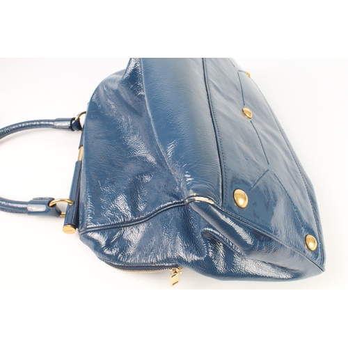 574 - A blue patent leather shoulder bag by Yves Saint Laurent - with brushed gold toned hardware, two bar... 