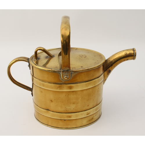 584 - Five pieces of brassware:
 a heavy Indian teapot of flattened globular form with tower-shaped neck a... 