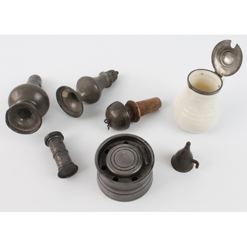 591 - Six pieces of pewter and a porcelain mustard pot with pewter lid, the larger caster 14 cm high.