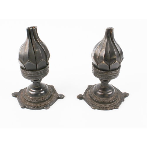 594 - A pair of patinated bronze lotus-form candle holders, possibly Tibetan - probably second half 20th c... 