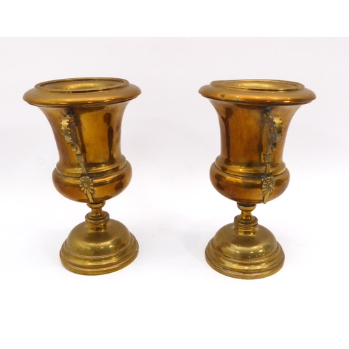 596 - A pair of 18th century style brass urns - early 20th century, with twin floral scroll handles and be... 