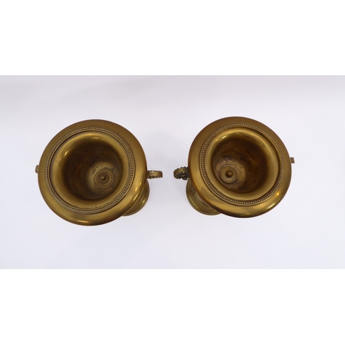 596 - A pair of 18th century style brass urns - early 20th century, with twin floral scroll handles and be... 