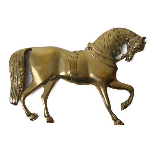 599 - A George III period brass relief horse plaque - the reverse with punched date '1760', well cast with... 