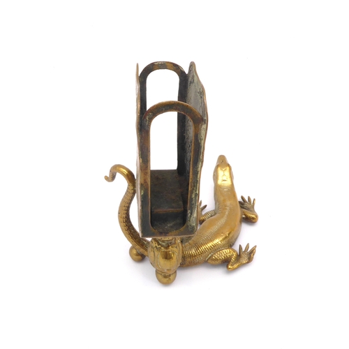 601 - A late 19th century novelty brass lizard match striker - the well detailed lizard with raised tail, ... 