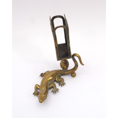 601 - A late 19th century novelty brass lizard match striker - the well detailed lizard with raised tail, ... 